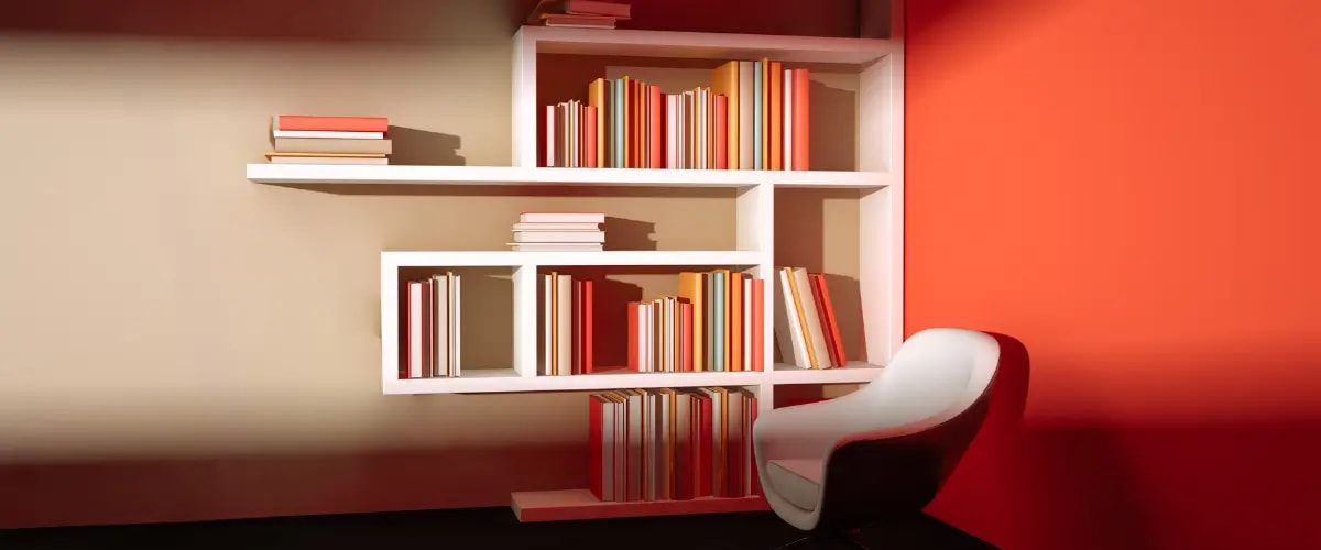 A well-stacked bookshelf in orange and other complementary colors.