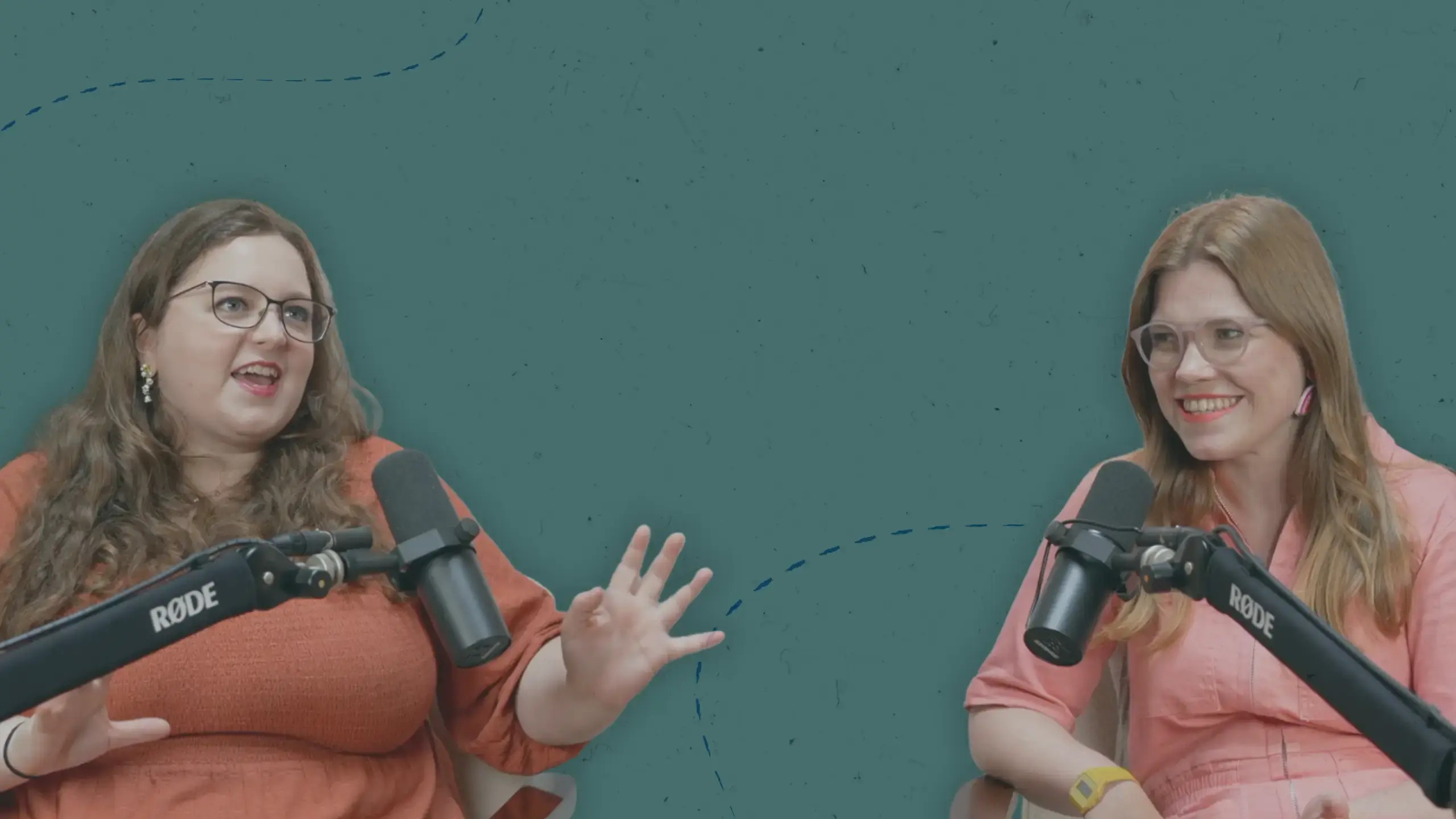 Editor and author Georgia Summers talks with author and writing coach Libby Page, recording microphones in front of them, against a green background.