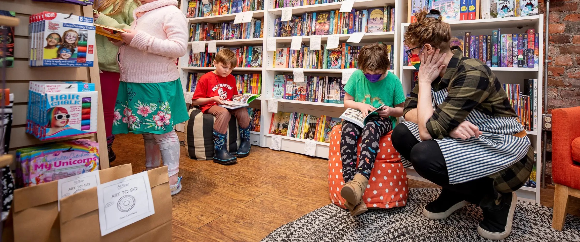 Children reading in the High Five Books bookstore in Massachusetts, USA.