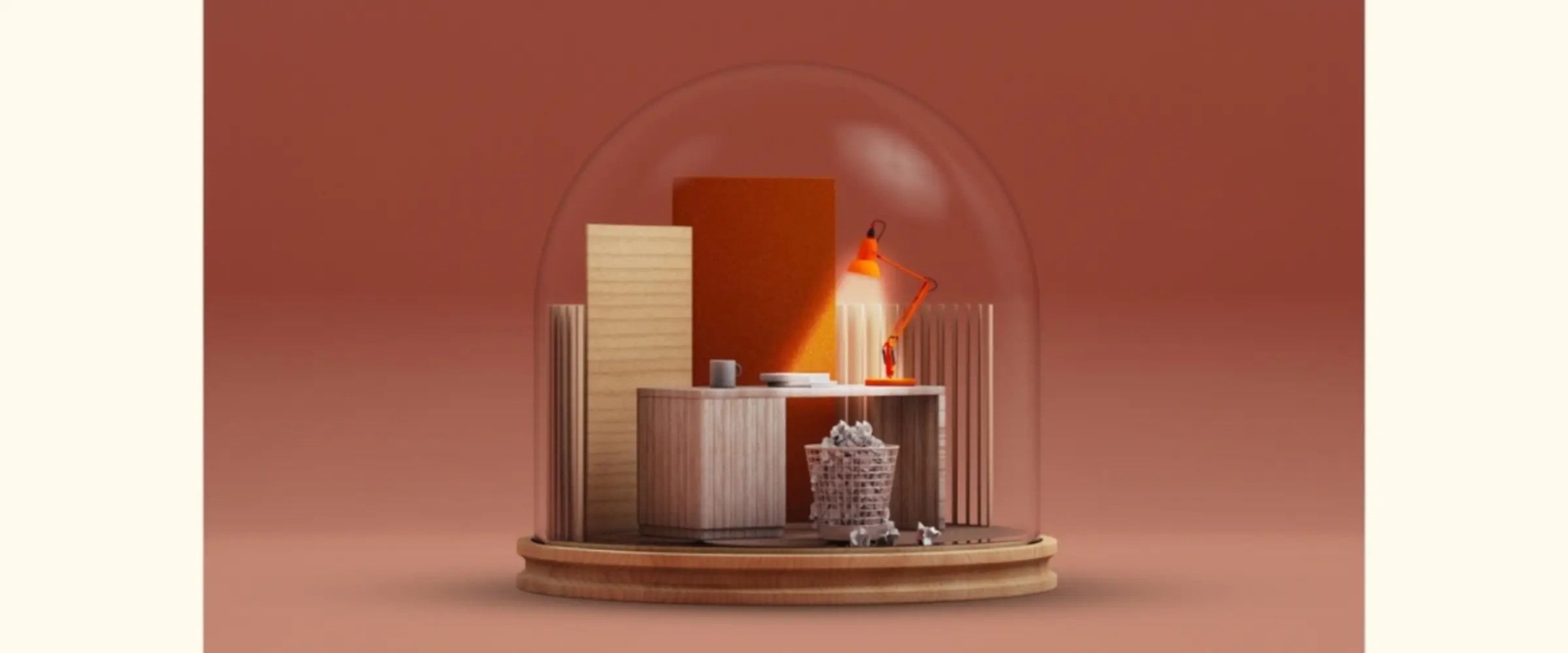 A graphic snowglobe containing a desk lit by an orange lamp and a full wastepaper bin.